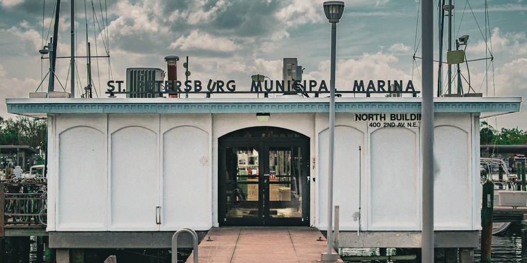 The St. Petersburg Municipal Marina north building under a dramatic sky, photographed by PowerFigure Productions