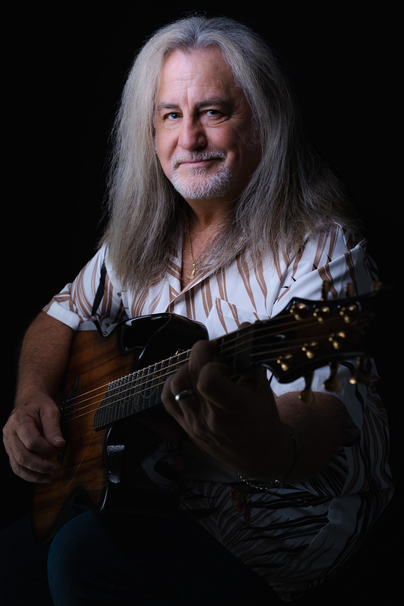 Dark, moody press portrait of Donnie Ray Reynolds