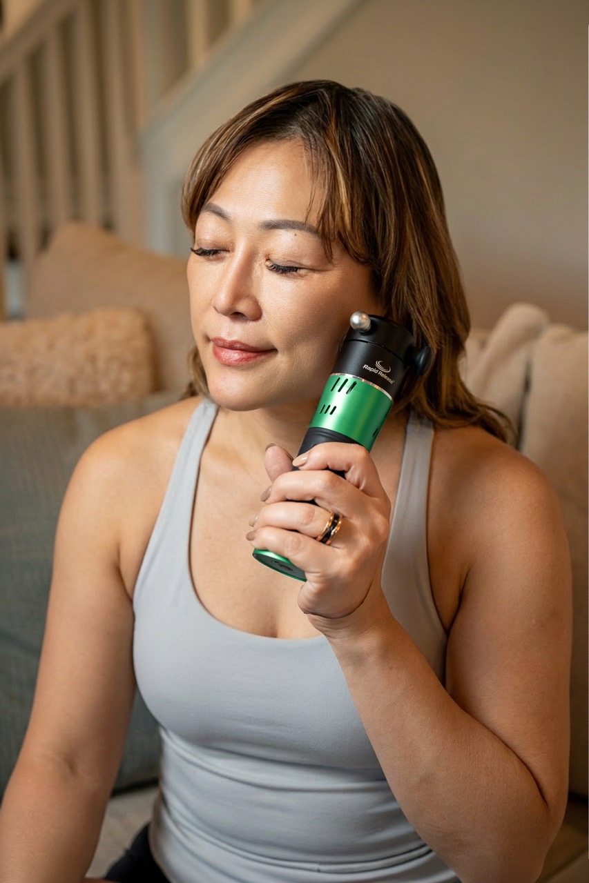Lifestyle frame of the Rapid Release Therapy routine on a sofa at home