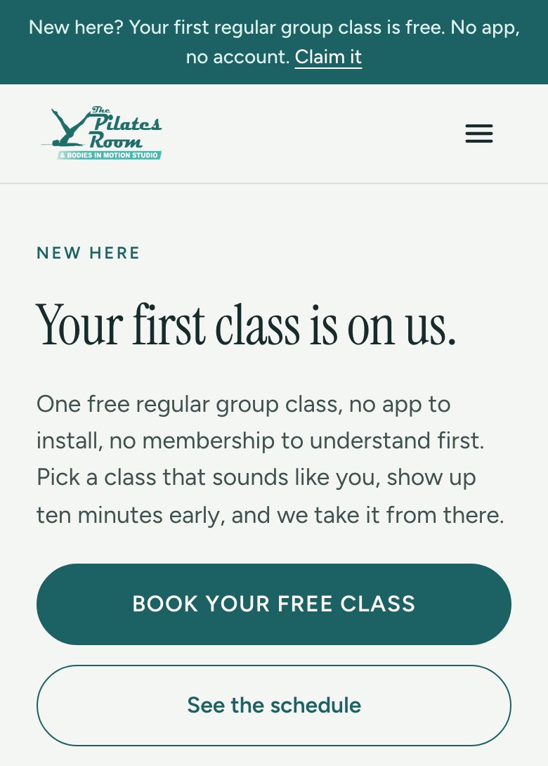 The Start here page on a phone: Your first class is on us, with a Book your free class button
