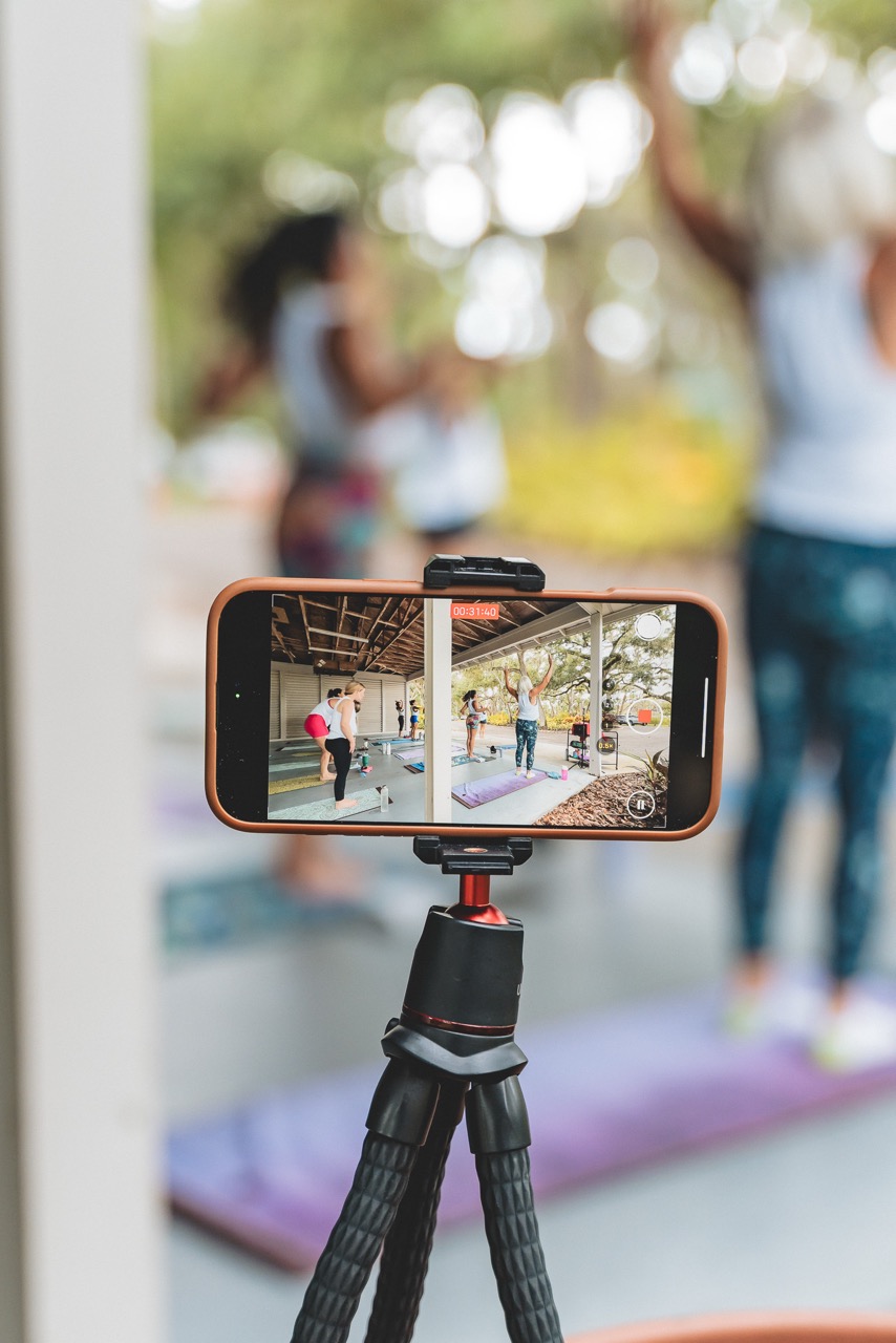 Production setup — phone on a tripod capturing the Abundance event