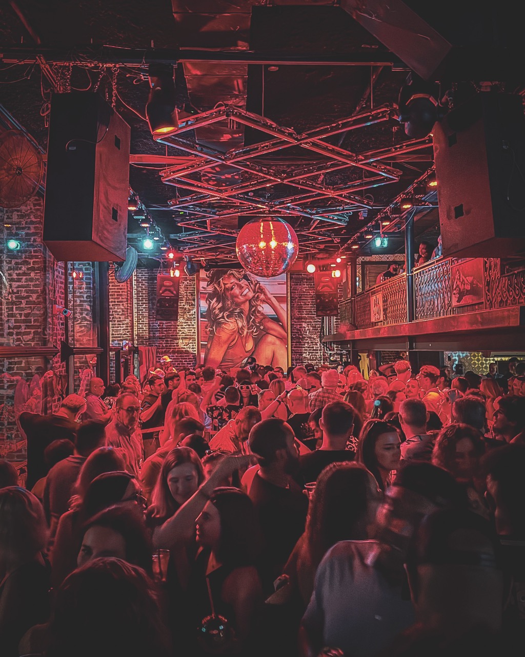 Nightlife crowd under red light, St. Petersburg