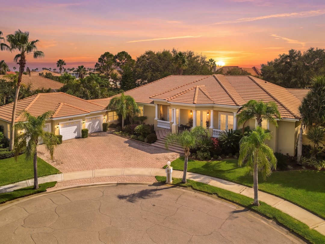 Twilight exterior of a Mediterranean-style luxury home