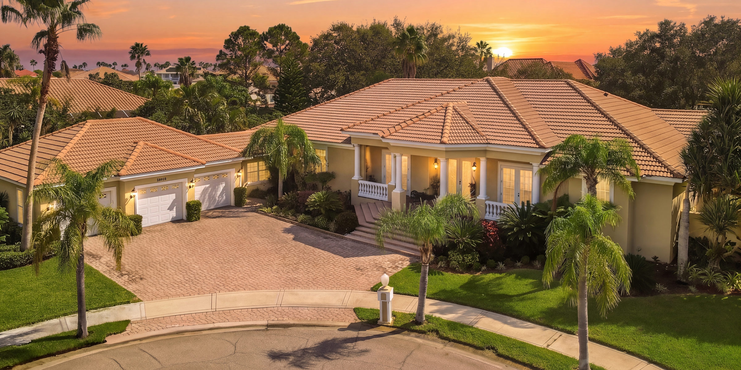 Twilight exterior of a Mediterranean-style luxury home in Tampa Bay